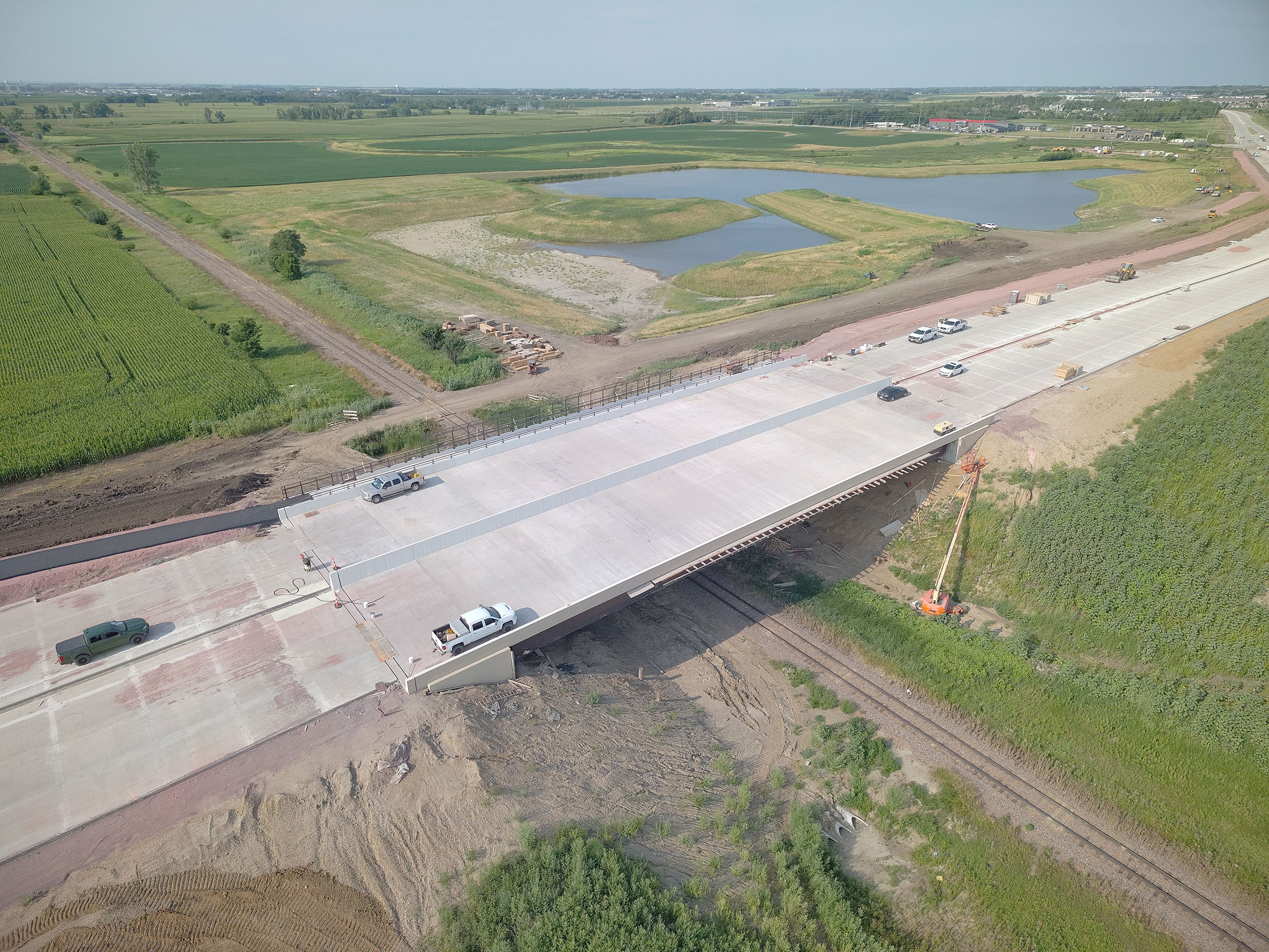 Aerial view of the BNSF railroad bridge and South Veterans Parkway construction corridor.