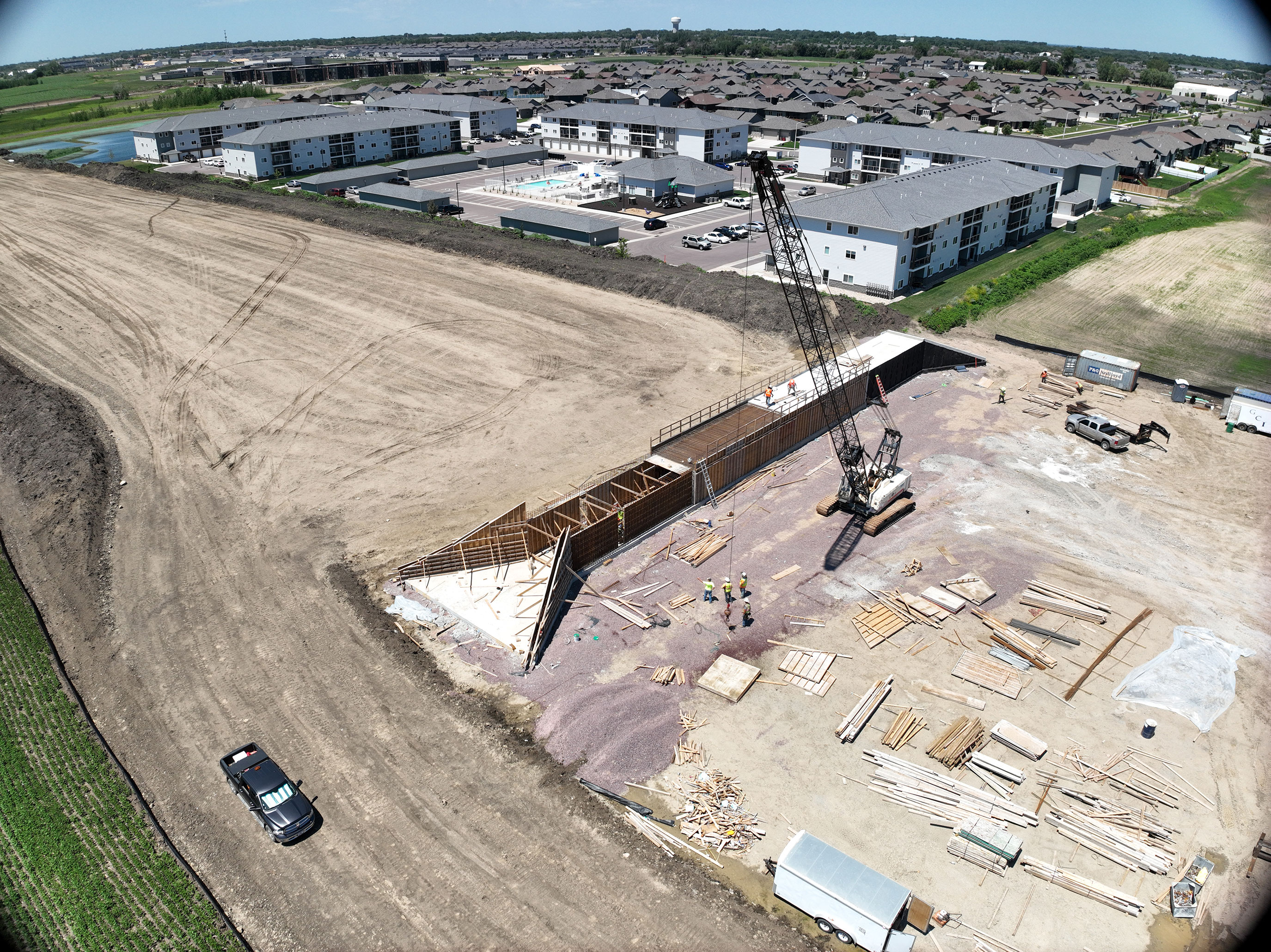 Drone view of construction area. Crane preparing to lift bridge equipment.
